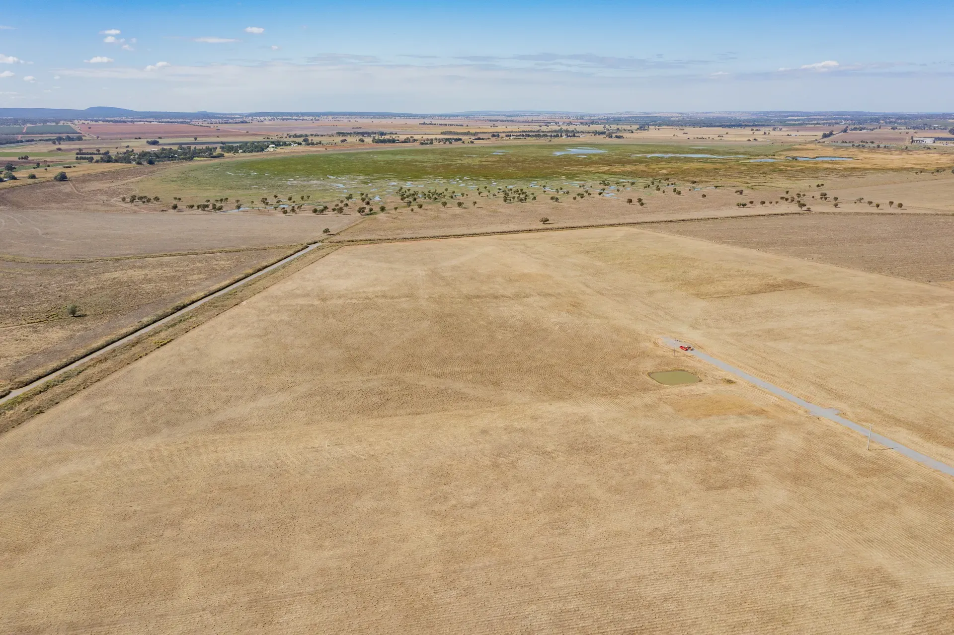 Wide aerial showing Leeton Rise estate context