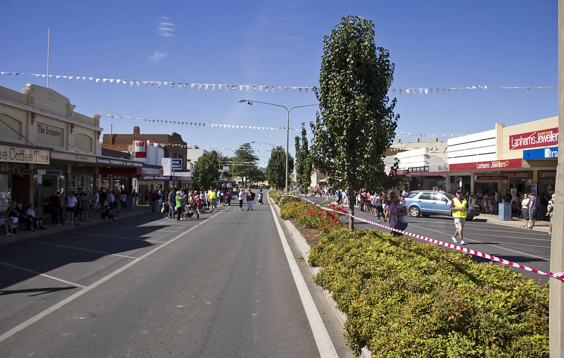 Looking down Pine Avenue, Leeton — main street with heritage shopfronts and median plantings